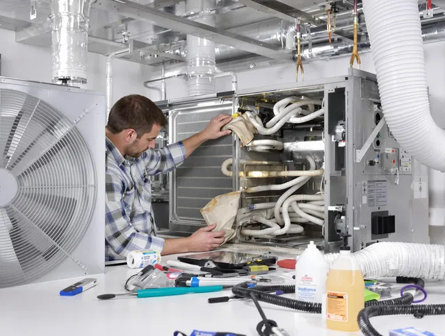 Abington Air Duct Cleaning specialist performing precision AC coil cleaning in Abington