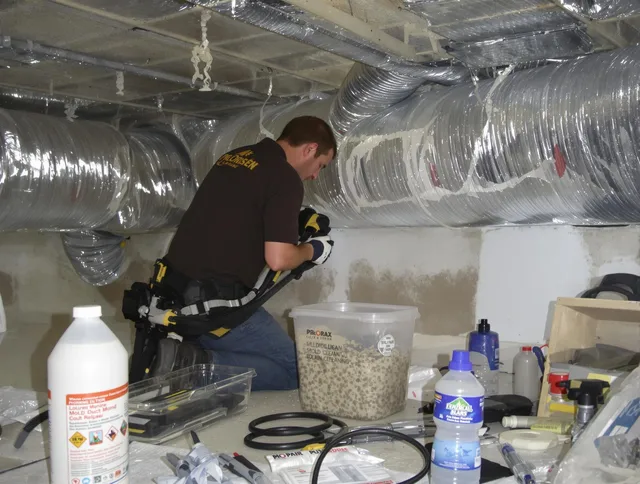 Abington Air Duct Cleaning specialist performing professional mold removal from air ducts in Abington