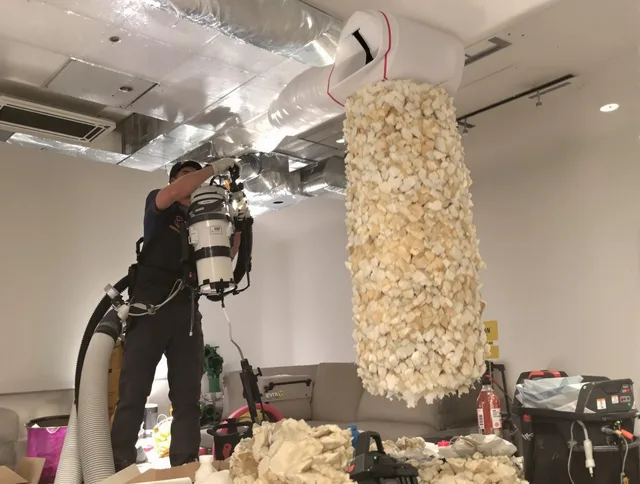 Abington Air Duct Cleaning technician performing precision vacuum insulation removal in a residential property in Abington