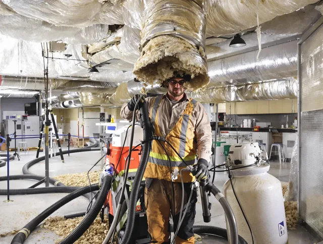 Professional vacuum insulation removal by Abington Air Duct Cleaning expert in Abington
